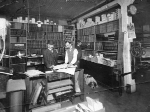 West End History Comes to Life at the Roedde House 3 Vancouver Bookbinding Company Ltd. office at 414 Hastings Street. Photograph shows G.A. Roedde, Thomas Barton and a dog. Image via City of Vancouver Archives.