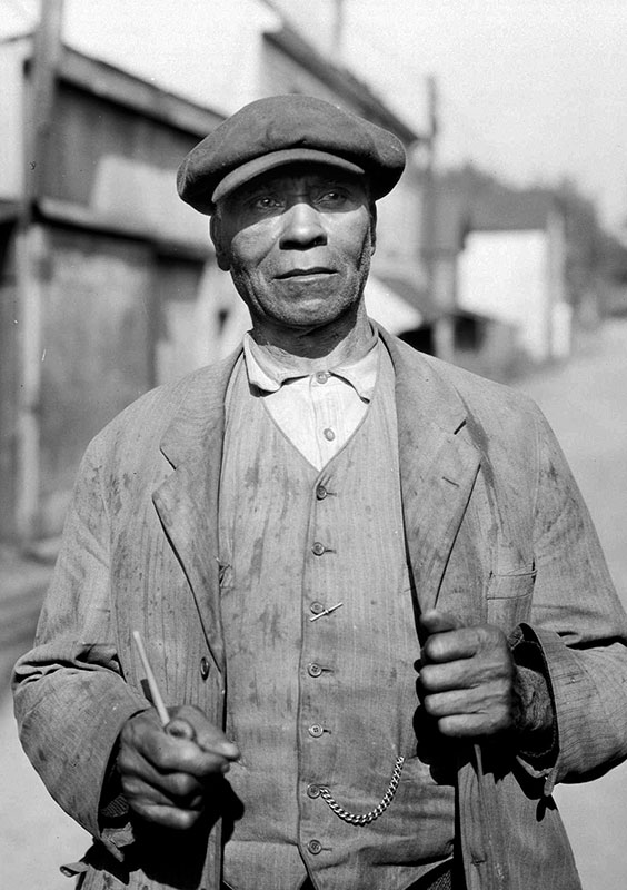 Fielding William Spotts – Hogan’s Alley, 1935 Fielding William Spotts came to British Columbia with the first wave of black immigrants from California in the 19th century. Here he is in Hogan's Alley in 1935, at the age of 78, when he lived at 217 1/2 Hogan's Alley. City of Vancouver Archives #Port N3.1.