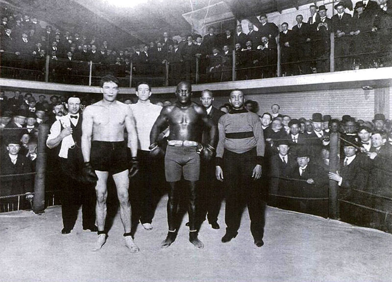 Jack Johnson vs. Victor McLaglan – Vancouver Athletic Club, 1909 Jack Johnson's first fight after becoming the first black heavyweight boxing champion of the world was a demonstration match at the Vancouver Athletic Club in Beatty Lane. He beat Victor MacLaglan, who later found more success as a Hollywood actor. On Johnson's right is George Paris, manager of the club. Photo courtesy Heritage House.